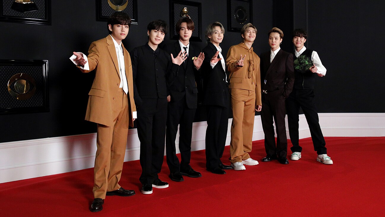 RM, Jin, SUGA, j-hope, Jimin, V and Jung Kook on a red carpet from the Disney+ docuseries, "BTS Monuments: Beyond The Star."