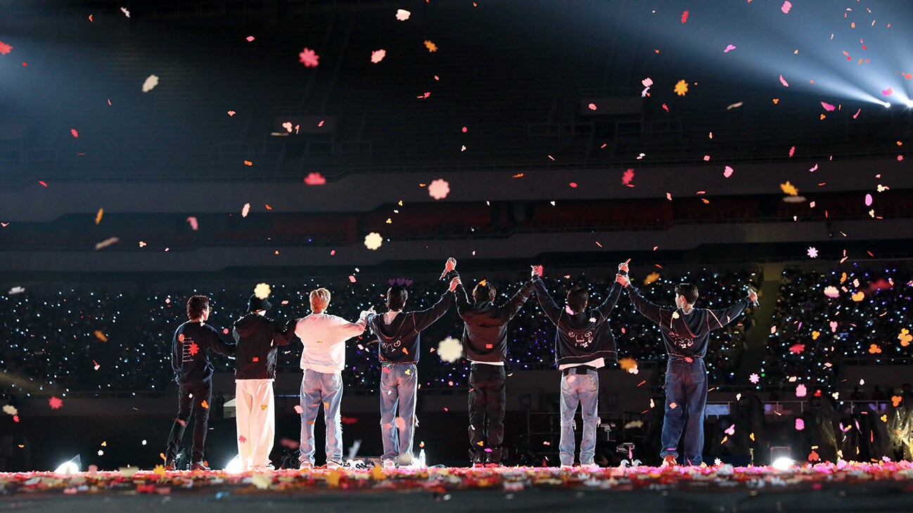 RM, Jin, SUGA, j-hope, Jimin, V and Jung Kook on stage from the Disney+ docuseries, "BTS Monuments: Beyond The Star."