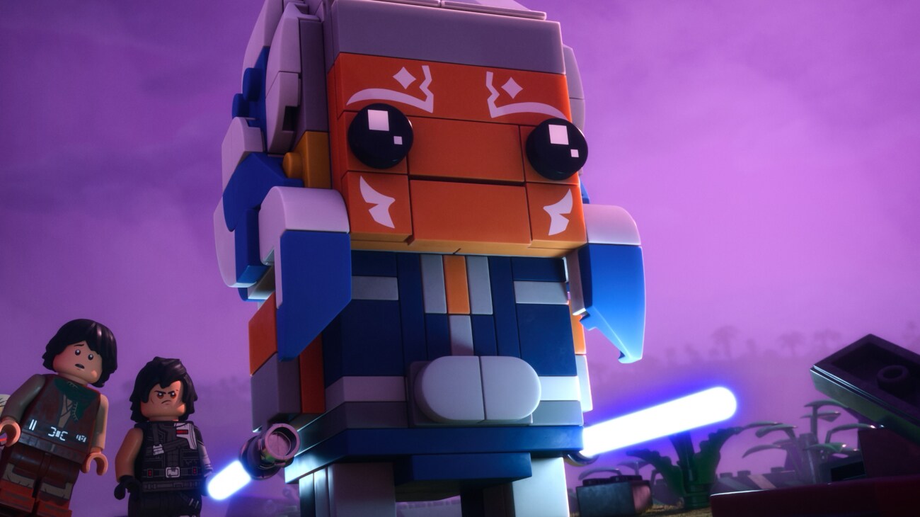 (L-R) Sig Greebling (Gaten Matarazzo), Dev Greebling (Tony Revolori), are rescued by Ahsoka Tano (Ashley Eckstein) in a scene from LEGO Star Wars: Rebuild the Galaxy - Pieces of the Past.