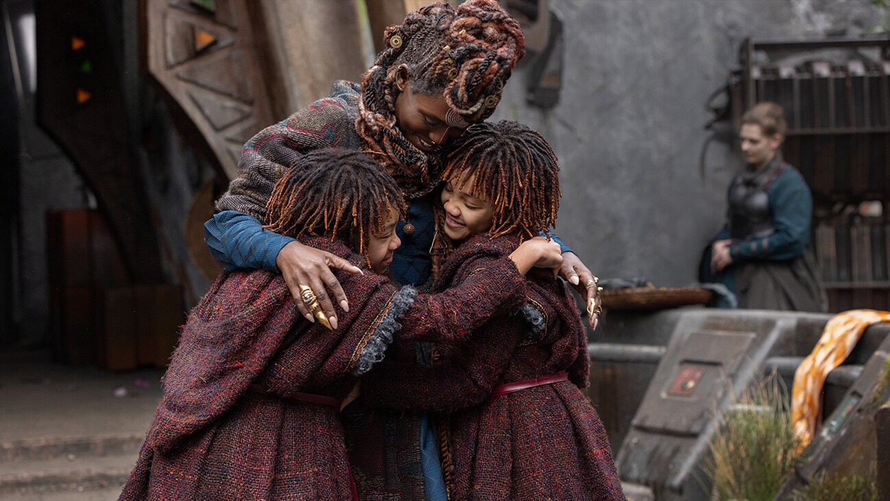 (L-R): Little Osha (Lauren Brady), Mother Aniseya (Jodie Turner-Smith) and Little Mae (Leah Brady) in Lucasfilm's THE ACOLYTE, season one, exclusively on Disney+. ©2024 Lucasfilm Ltd. & TM. All Rights Reserved.