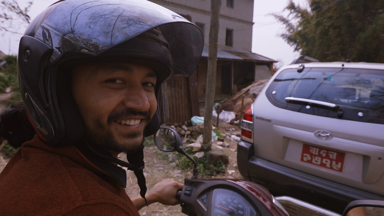 Bhaktapur, Nepal - Santosh Pandey rides a motorcycle through his hometown of Bhaktapur, Nepa. (Credit: Future of Work Film Inc)