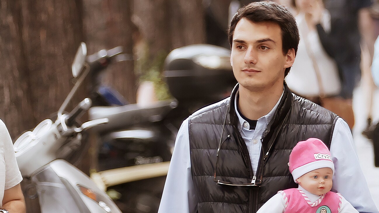 Thessaloniki, Greece - Jason Hadzikostas holding a doll which is used for his app, iCry2Talk. (Credit: Future of Work Film Inc)