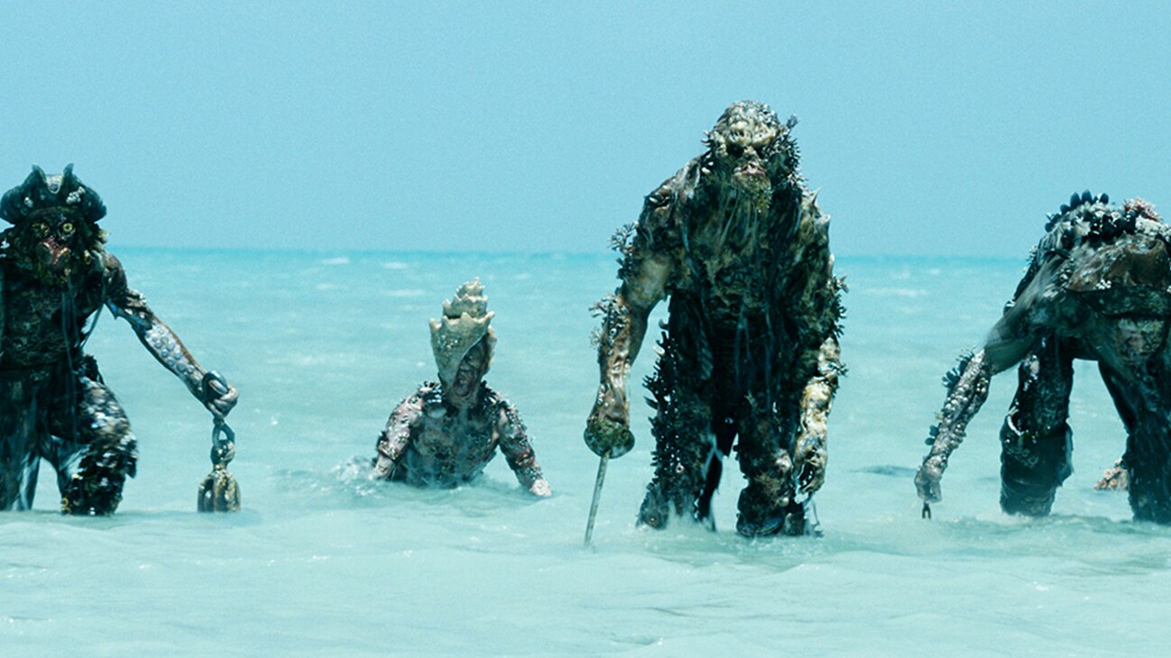 Several creatures emerging from the water in the Disney movie Pirates of the Caribbean: Dead Man's Chest.