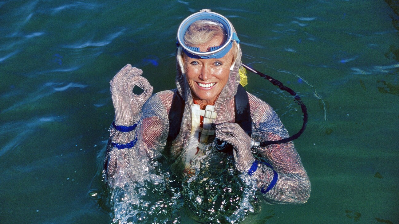 Valerie Taylor in water wearing a chain mail suit in 1982. (photo credit: Ron & Valerie Taylor)