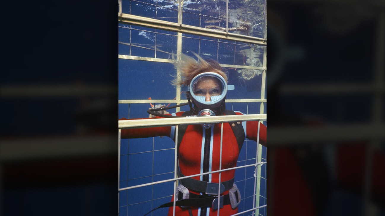 Valerie Taylor underwater in a shark cage in 1968. (photo credit: Ron & Valerie Taylor)