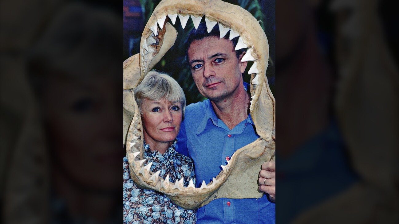 Ron & Valerie Taylor framed by a shark jaw skeleton. (photo credit: Ron & Valerie Taylor)