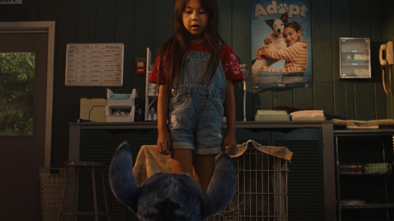 (L-R) Stitch and Maia Kealoha as Lilo in Disney’s live-action LILO & STITCH. Photo courtesy of Disney. © 2024 Disney Enterprises Inc. All Rights Reserved.