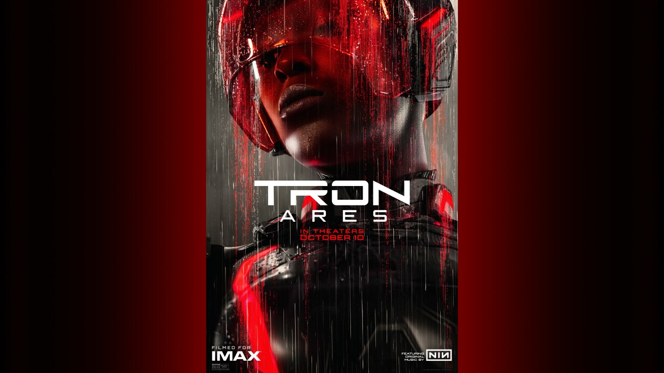 Image of Athena (Jodie Turner-Smith) with digital characters appearing as falling rain | Tron: Ares | In theaters October 10 | Filmed for IMAX | Featuring original music by NIN | Rated PG-13 | © 2025 Disney Enterprises, Inc. All Rights Reserved | poster image