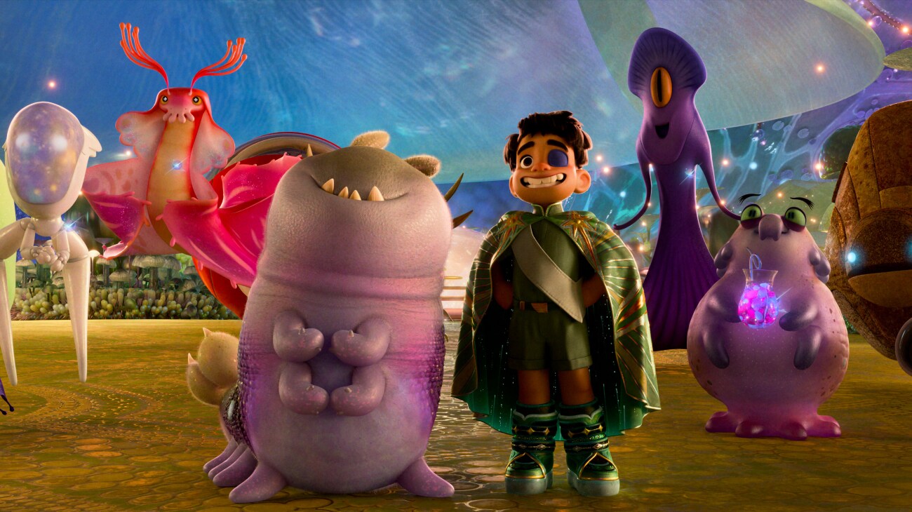 TAKING UP SPACE – When 11-year-old Elio (voice of Yonas Kibreab) is beamed up to space, he finds himself in the Communiverse. He makes his first real friend, an alien called Glordon (voice of Remy Edgerly), and meets representatives from galaxies far and wide. Among them are Ambassador Tegman (far right), Ambassador Helix (second from right), Ambassador Turais (third from right) and Ambassador Questa (left of Glordon). Disney and Pixar’s “Elio” releases in theaters June 20, 2025. © 2025 Disney/Pixar. All Rights Reserved.