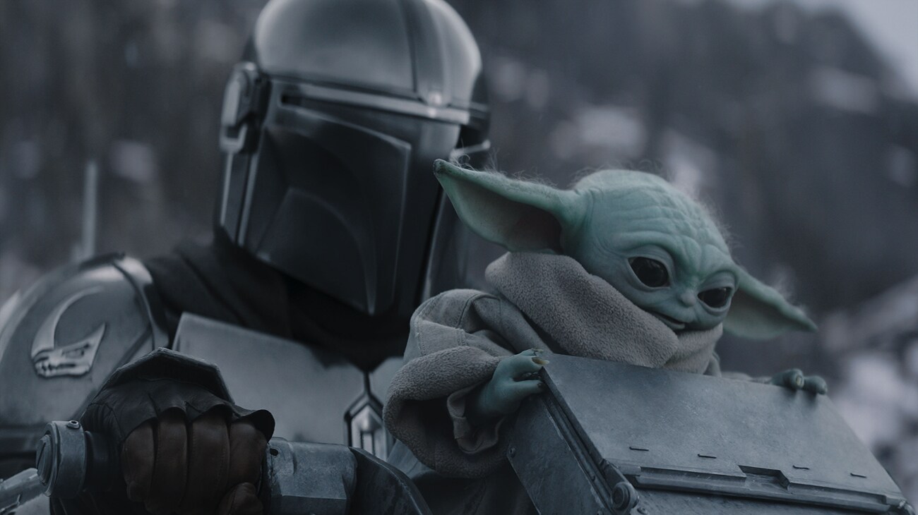(L-R) The Mandalorian and Grogu in Lucasfilm's THE MANDALORIAN AND GROGU. Photo courtesy of Lucasfilm. © 2026 Lucasfilm Ltd™. All Rights Reserved.