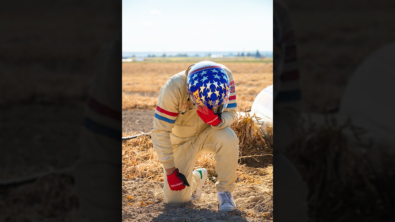 Image of Eddie Braun kneeling from the Disney+ Originals movie Stuntman. (Disney/ Steve Dondero)