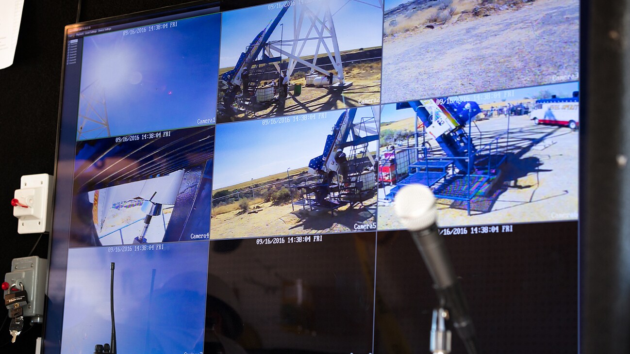 Image of nine TV screens showing different angles of the rocket launch pad from the Disney movie Stuntman. (Disney/ Steve Dondero)