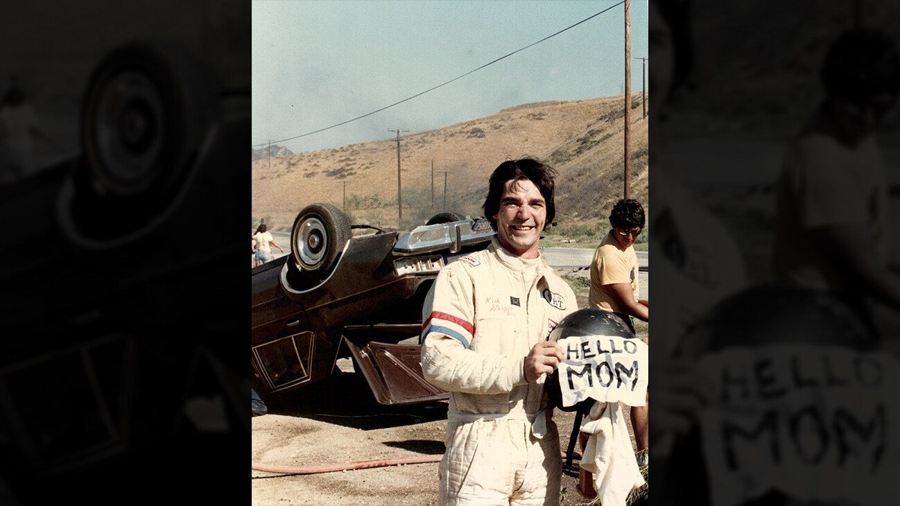 Picture of Eddie Braun in front of an upside down car from the Disney+ Originals movie Stuntman. (Disney)