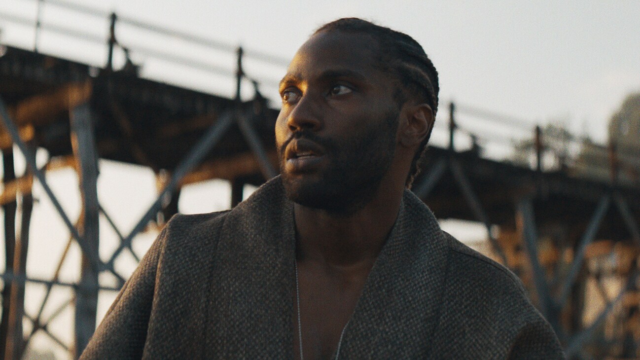 John David Washington as Joshua in 20th Century Studios' THE CREATOR. Photo courtesy of 20th Century Studios. © 2023 20th Century Studios. All Rights Reserved.