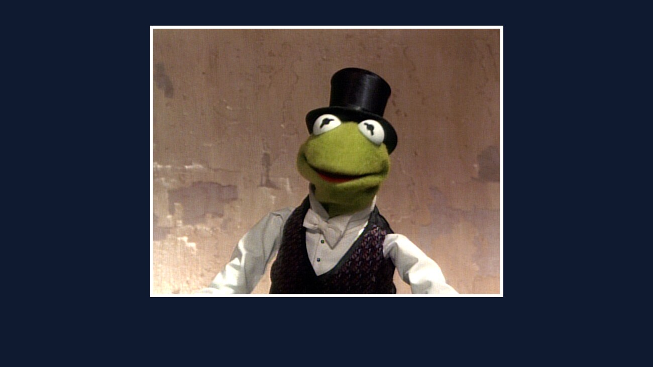 Kermit the Frog in a top hat from the Disney movie The Great Muppet Caper.