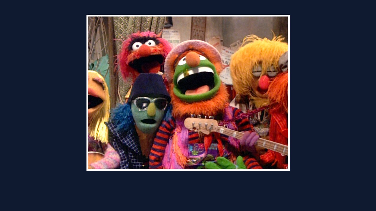 Dr. Teeth, Animal, Zoot, Janice, Lips, and Floyd Pepper from the Disney movie The Great Muppet Caper.