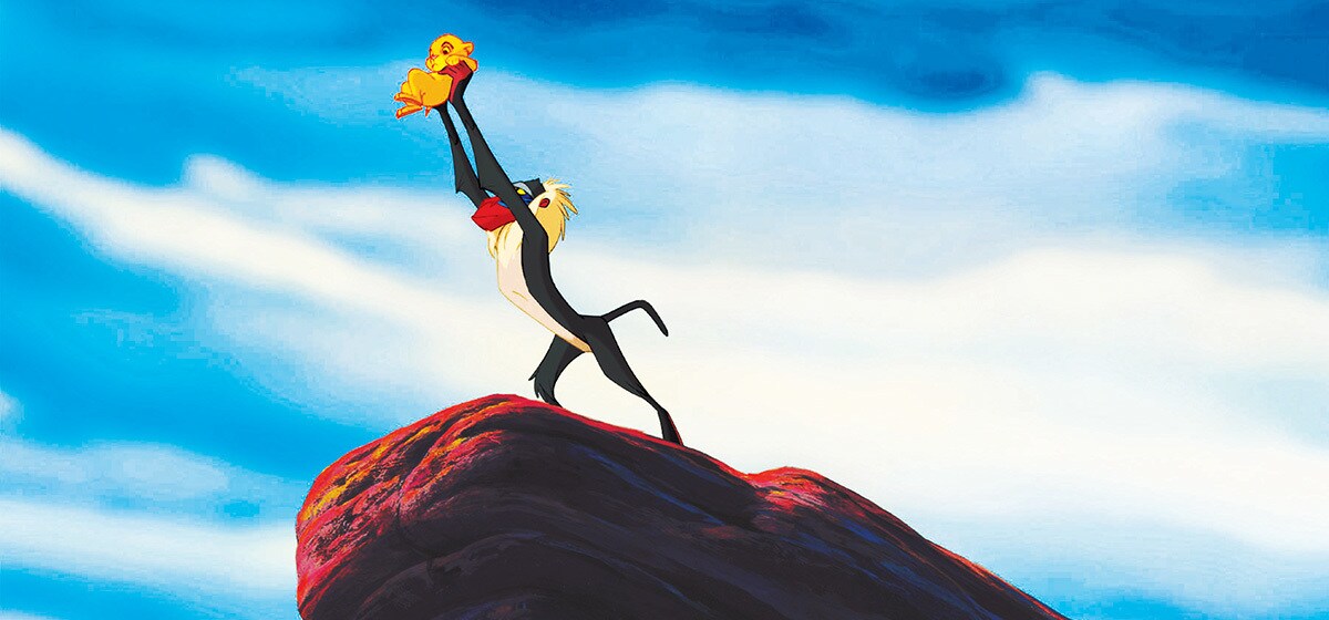 Robert Guillaume (Rafiki) holds the new born baby (Simba) in "The Lion King"