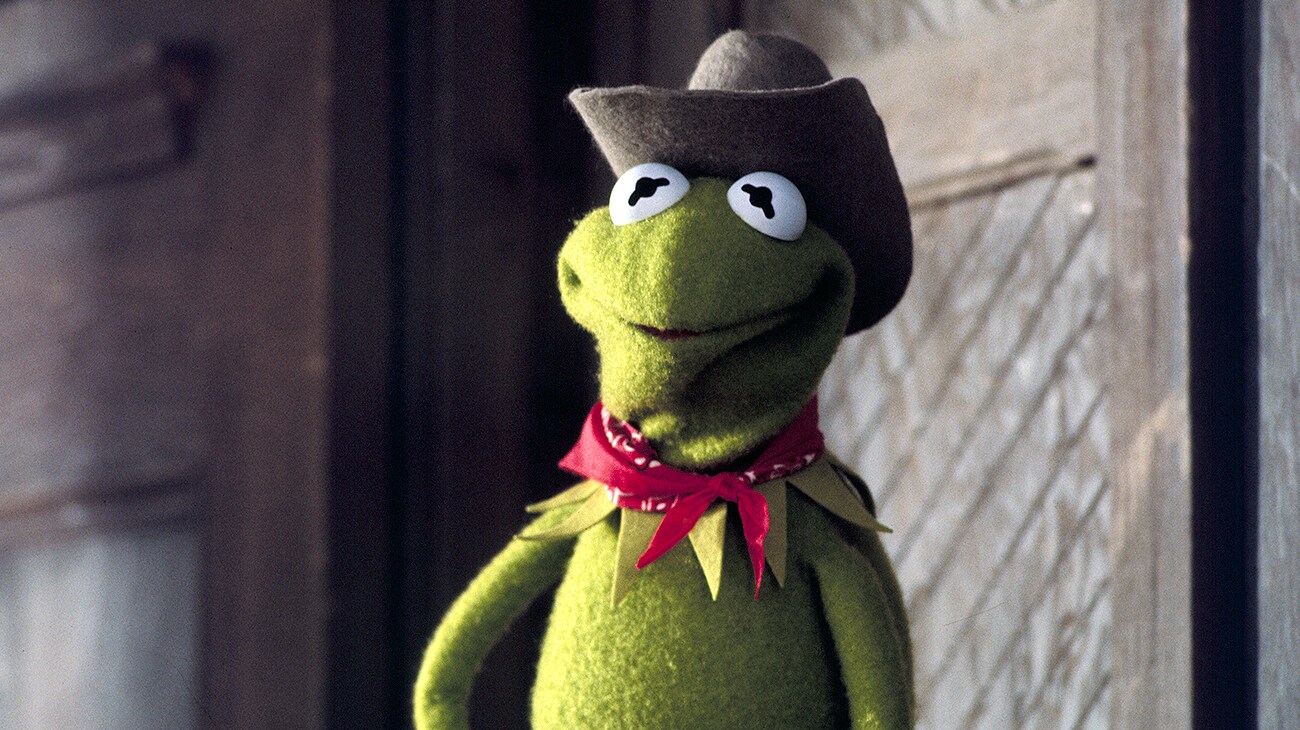 Kermit The Frog wearing a cowboy hat and red bandana in The Muppet Movie