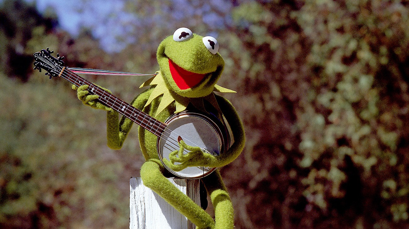 Kermit the Frog voiced by  playing a banjo in The Muppet Movie