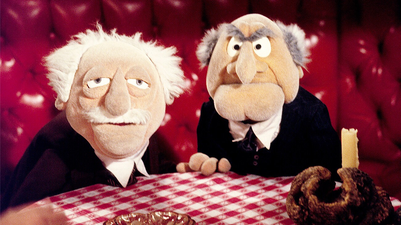 Statler and Waldorf at a table in The Muppet Movie