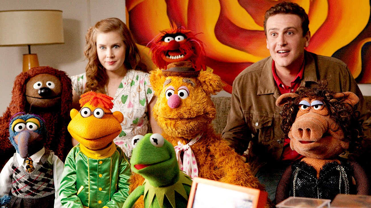 A group of muppets with Gry played by Jason Segel, look surprised