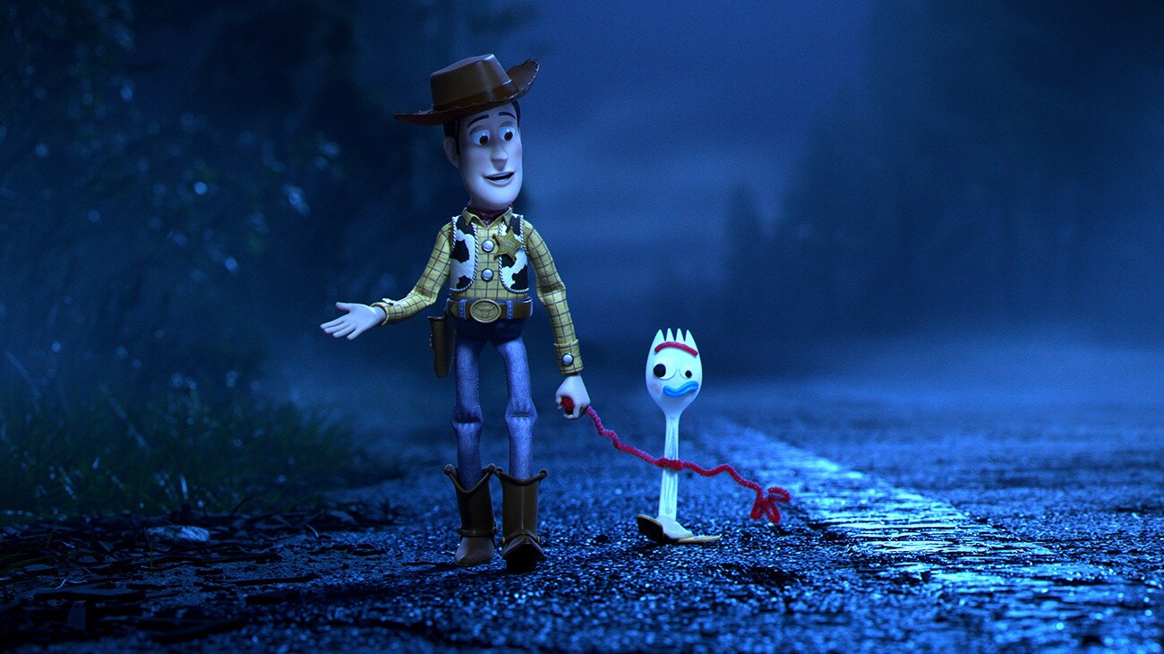 Woody and Forky walking together in the animated movie "Toy Story 4"