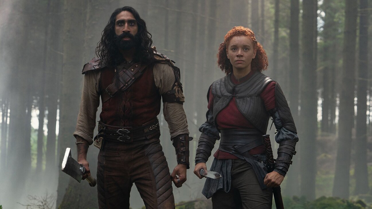 (L-R): Boorman (Amar Chadha-Patel) and Jade (Erin Kellyman) in Lucasfilm's WILLOW exclusively on Disney+. ©2022 Lucasfilm Ltd. & TM. All Rights Reserved.