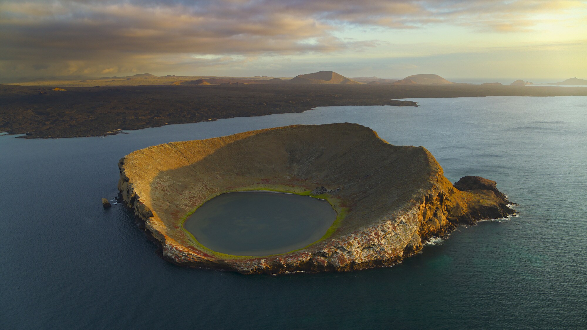 Drone Aerial shot of Bainbridge rock as the daylight fades. (National Geographic for Disney+/Bertie Gregory)