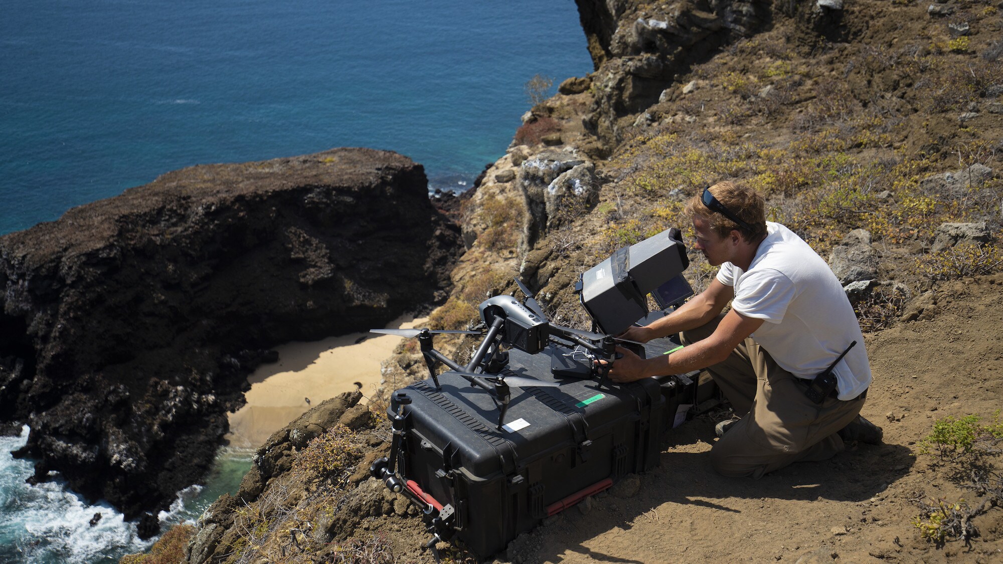 Bertie Gregory views drone footage on a monitor. (National Geographic for Disney+/Rakel Hansen)