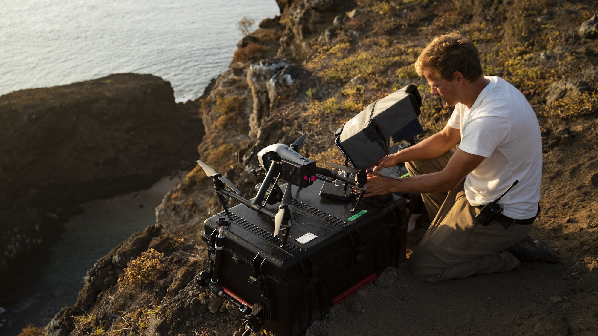 Bertie Gregory views drone footage. (National Geographic for Disney+/Rakel Hansen)