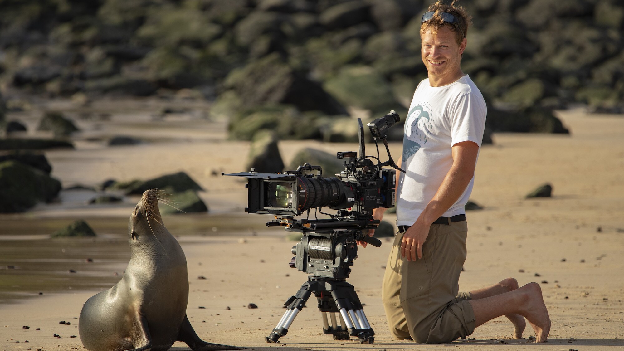 Bertie Gregory filming a seal. (National Geographic for Disney+/James Brickell)