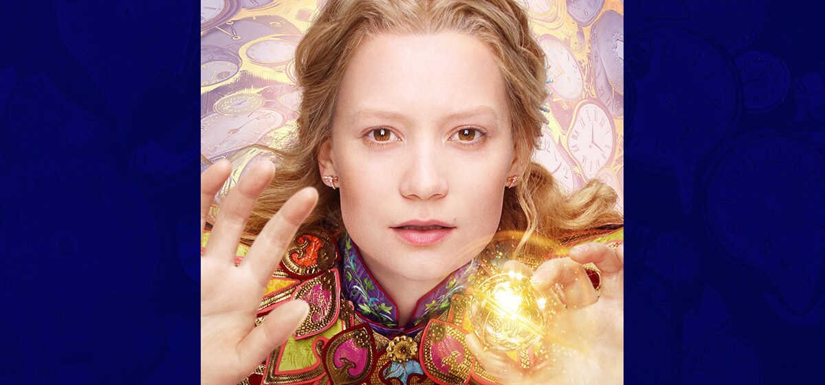 Mia Wasikowska as Alice Kingsleigh holding a glowing ball in the movie "Alice Through the Looking Glass"