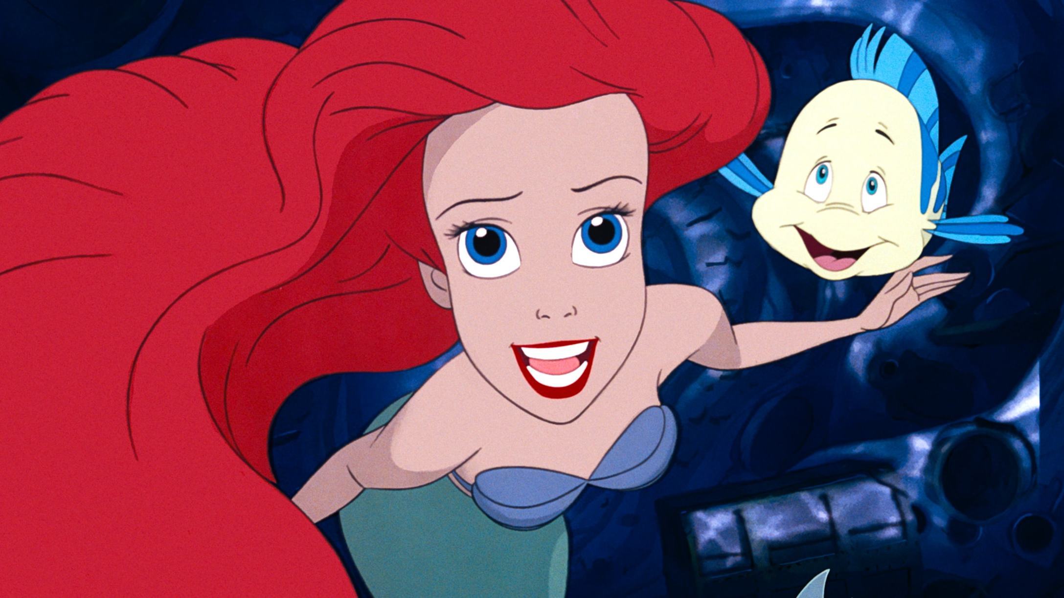 Flounder and Ariel swimming to the top of her grotto.