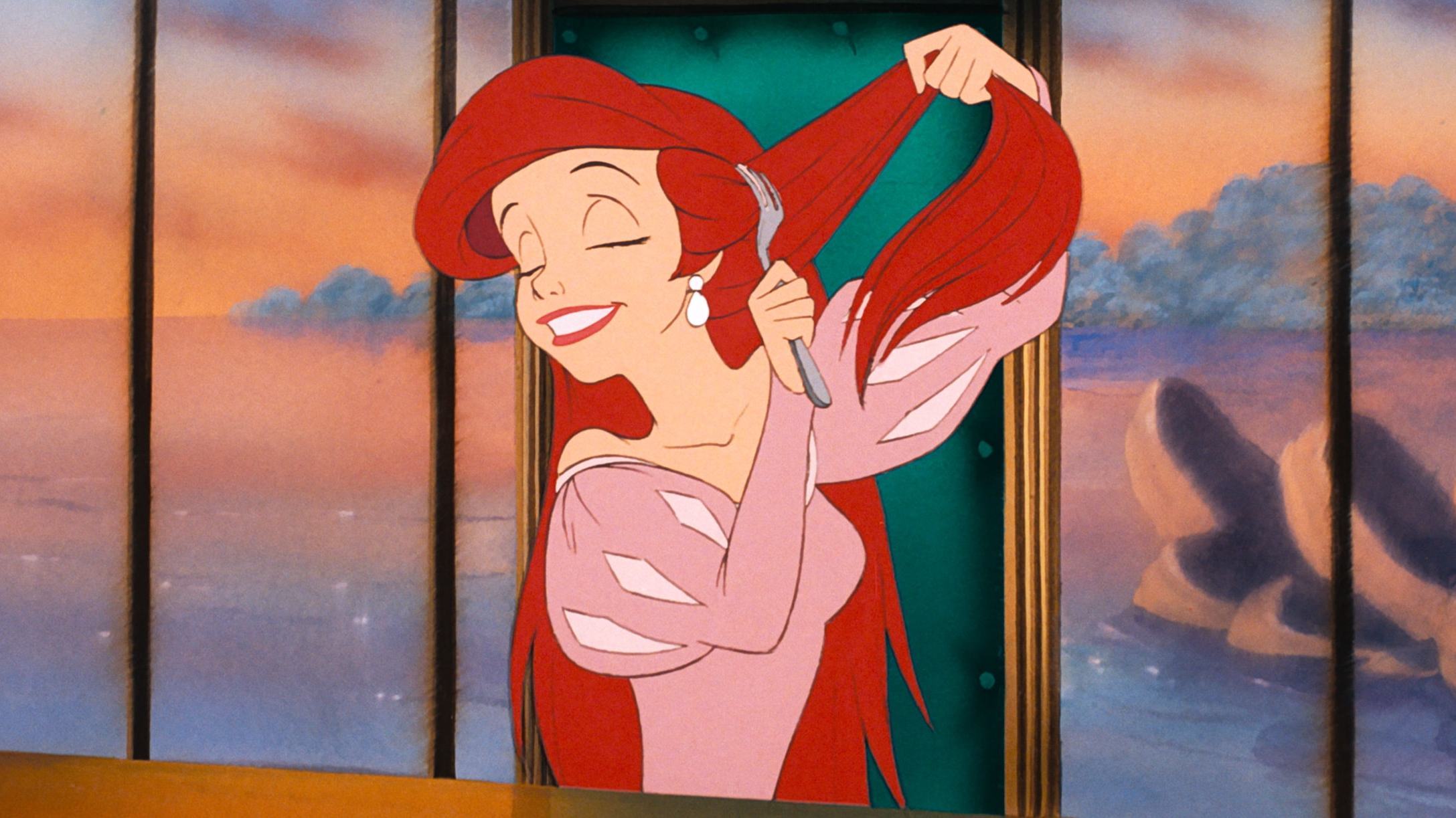 Ariel brushing her hair with her dinglehopper.