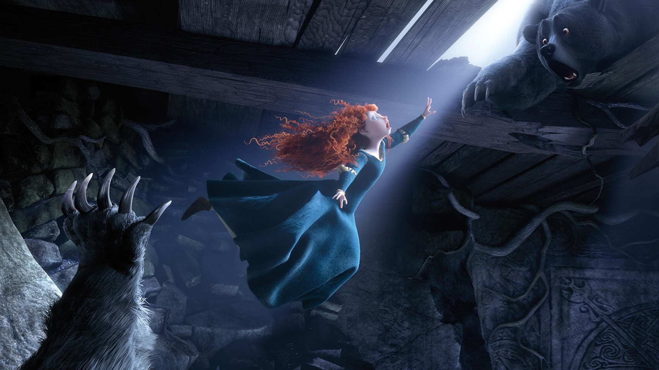 Merida reaches for her mother's help as she tries to escape from the bear.
