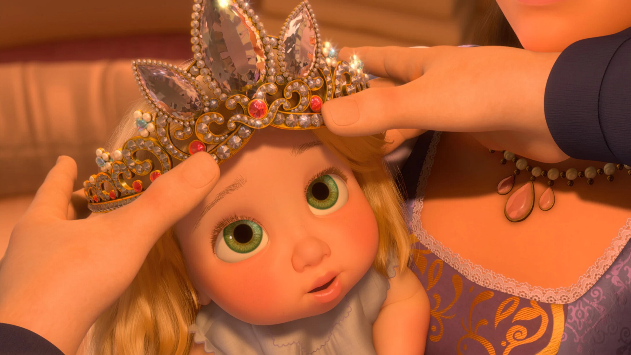 Baby Rapunzel getting her princess crown.