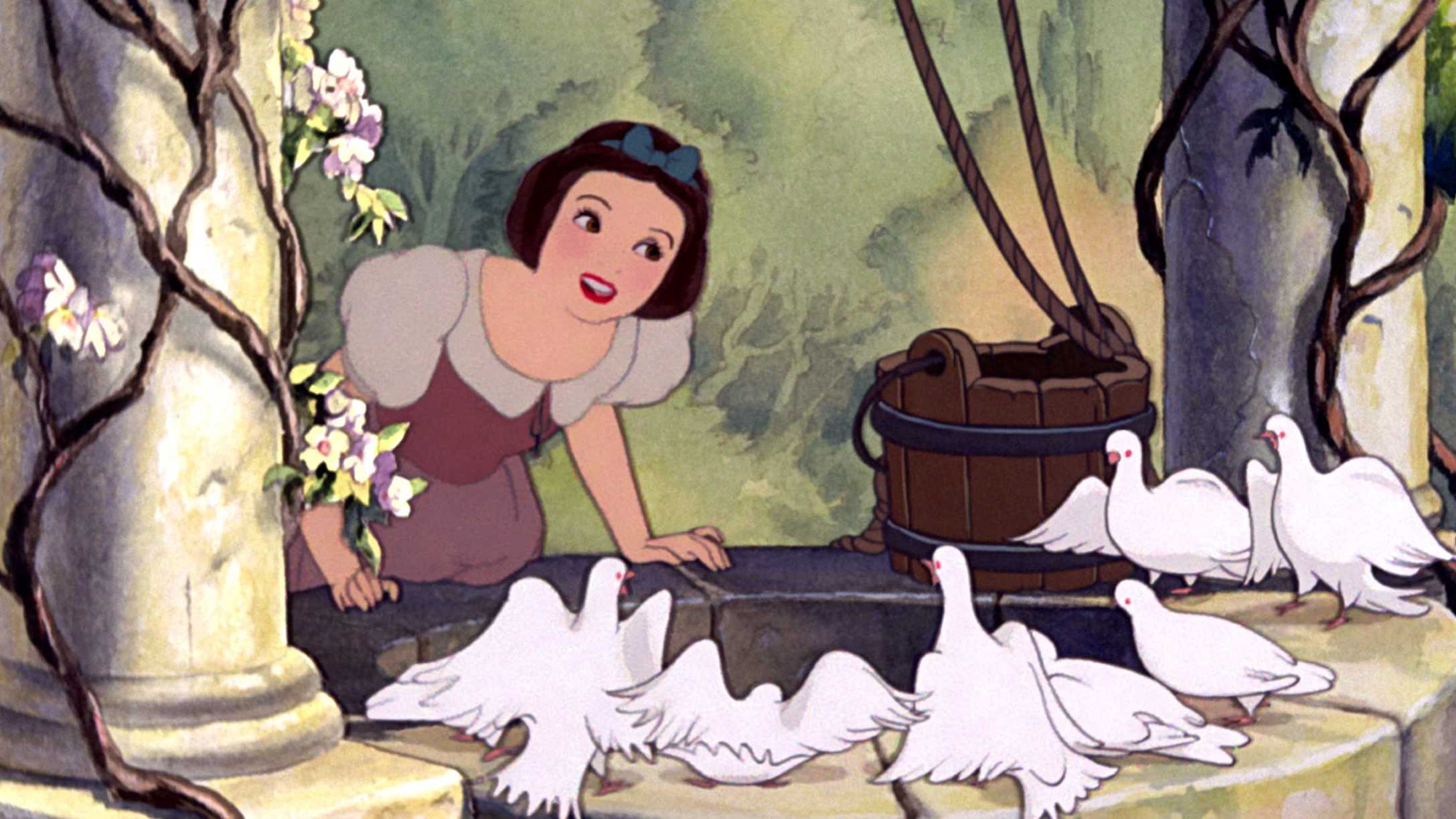 Snow White standing by a wishing well with her animal friends.