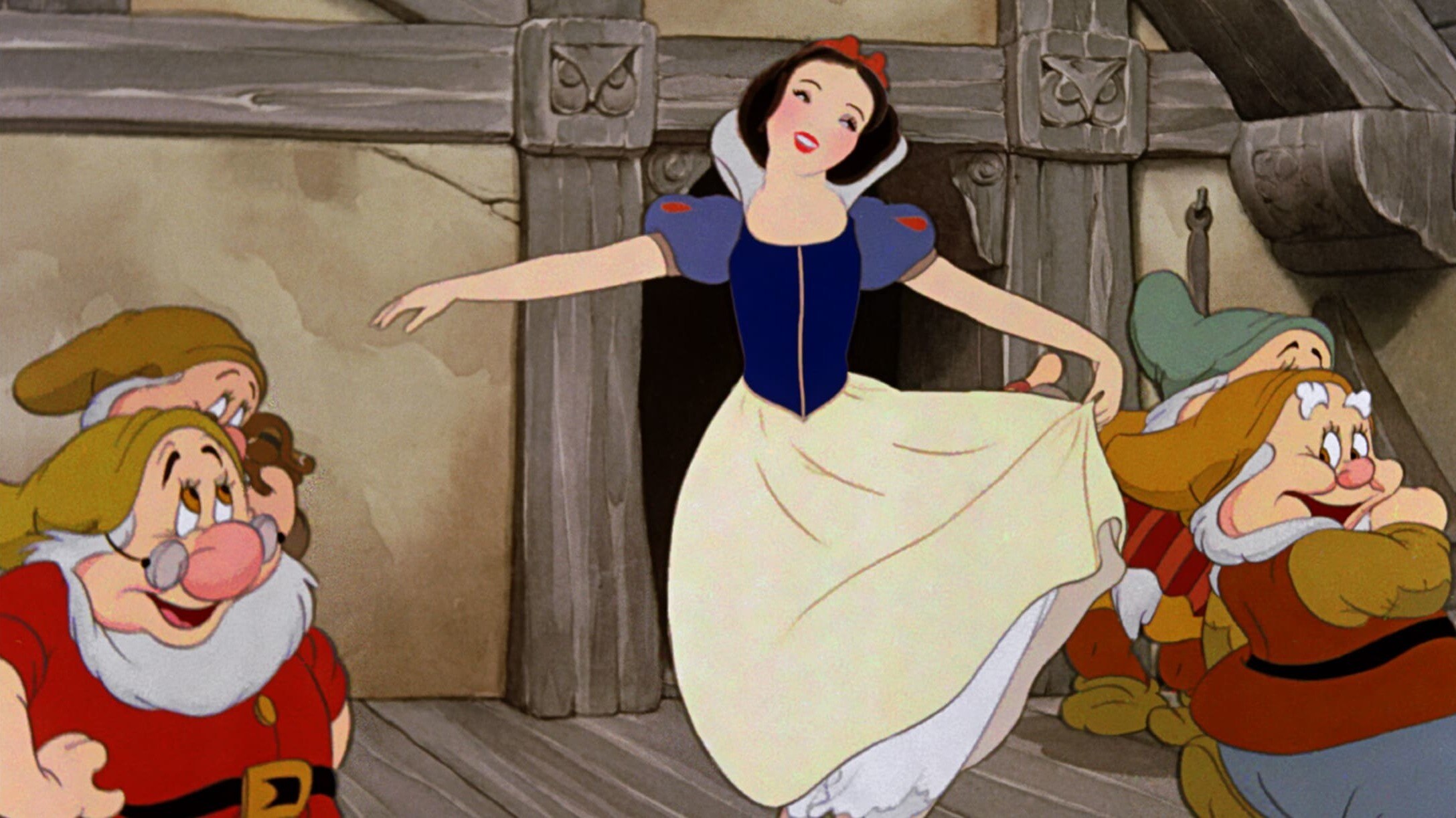 Snow White dancing with the Seven Dwarfs.