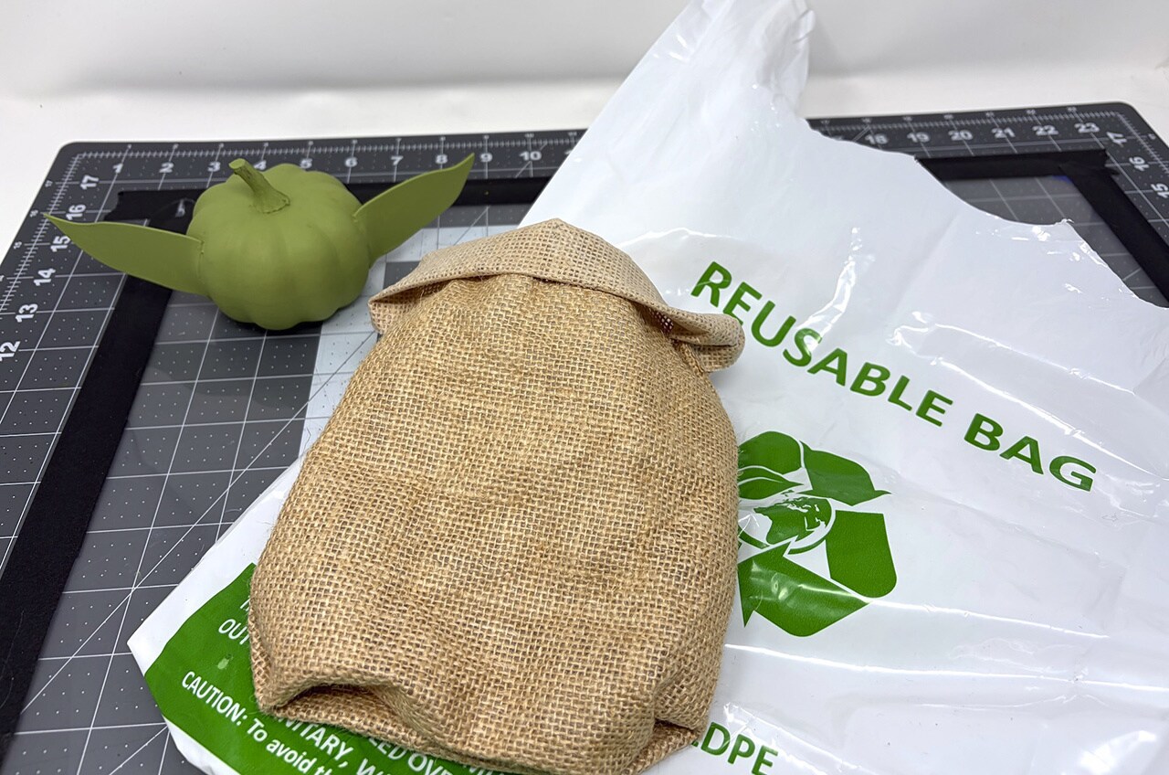 Step 9: Stuff a plastic grocery bag inside the burlap bag you made to make Grogu’s body.