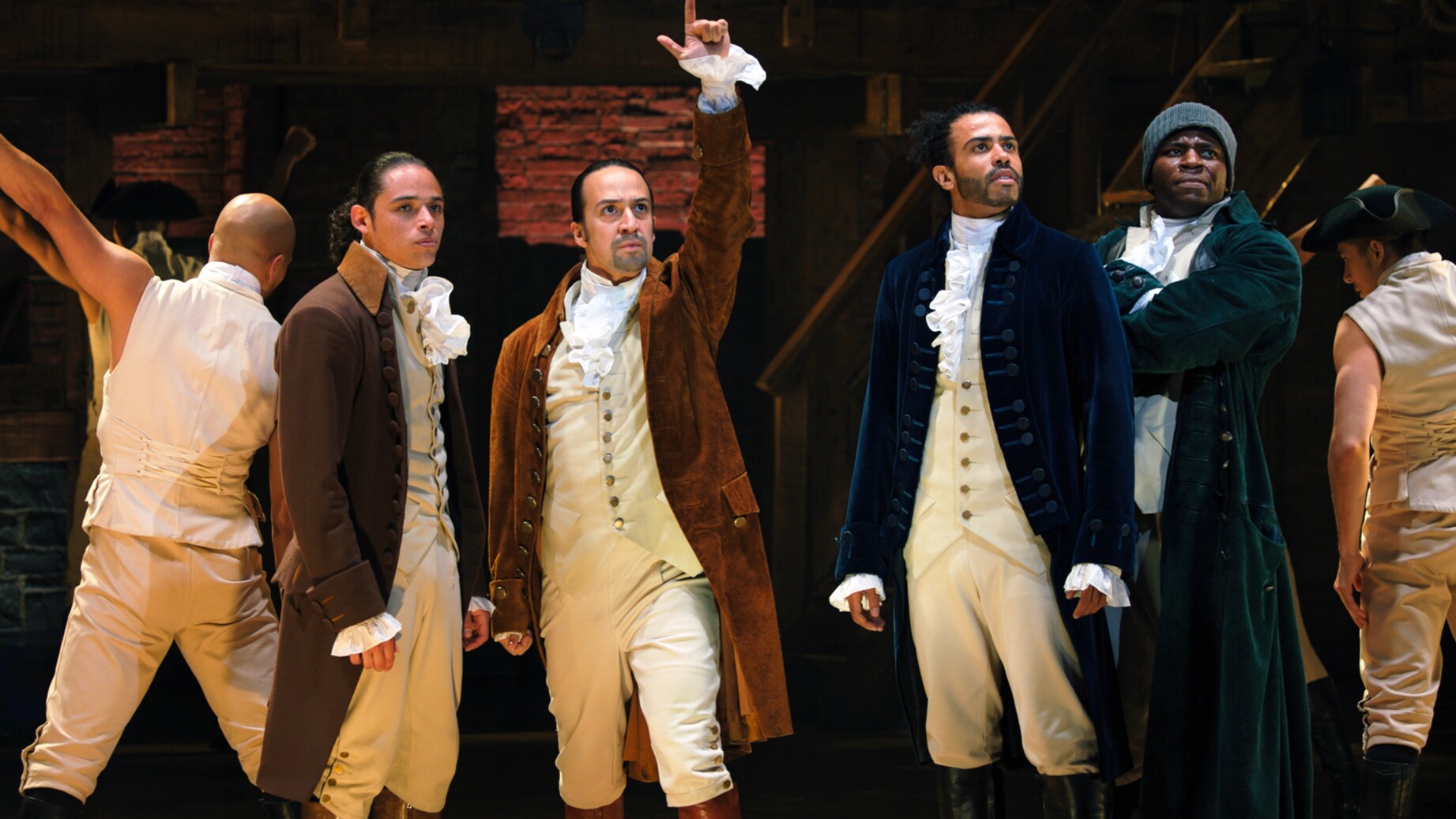 (L-R): Anthony Ramos is John Laurens, Lin-Manuel Miranda is Alexander Hamilton, Daveed Diggs is the Marquis de Lafayette, and Okieriete Onaodowan is Hercules Mulligan in HAMILTON, the filmed version of the original Broadway production.