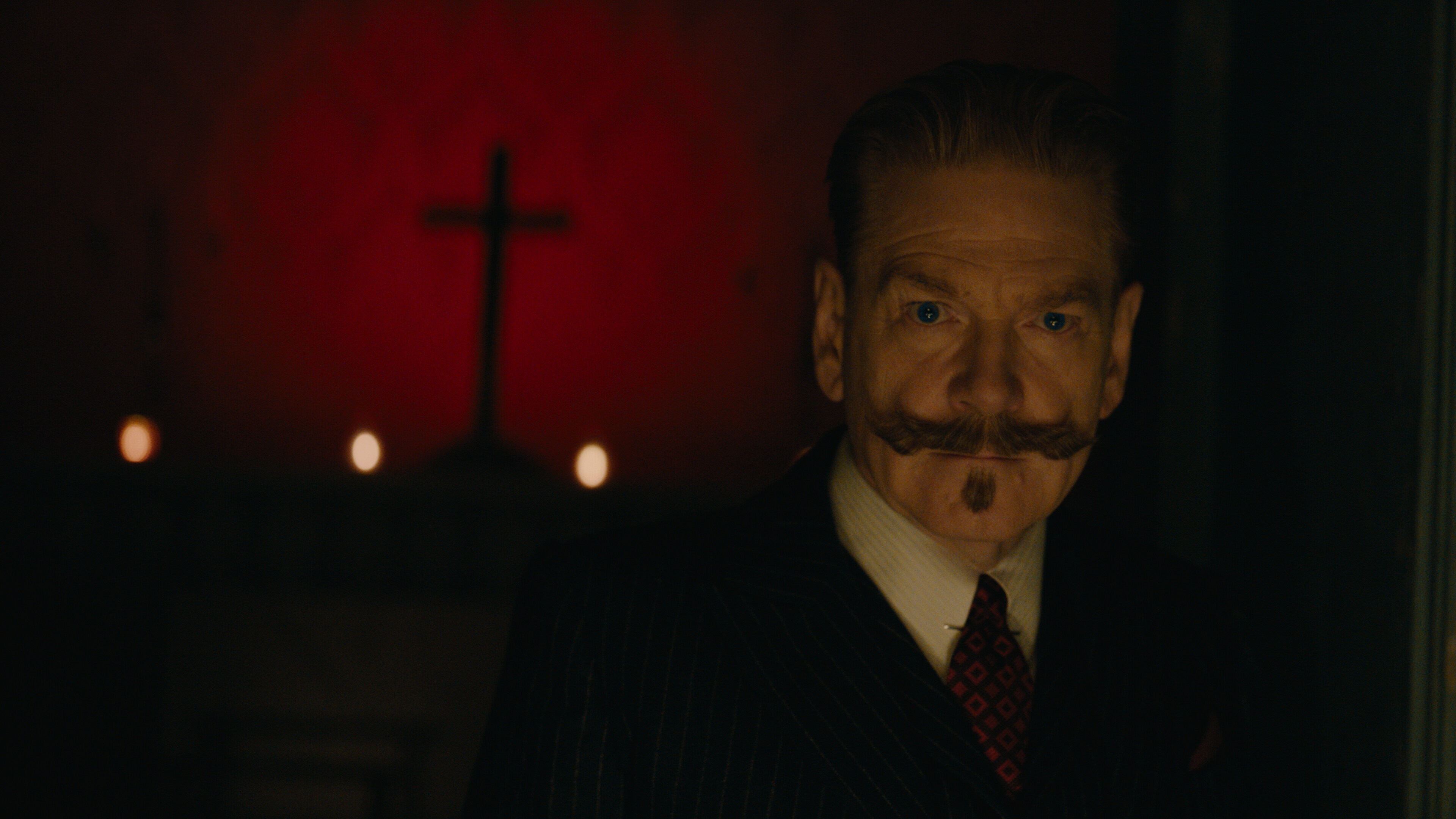 Poirot in a dark room.
