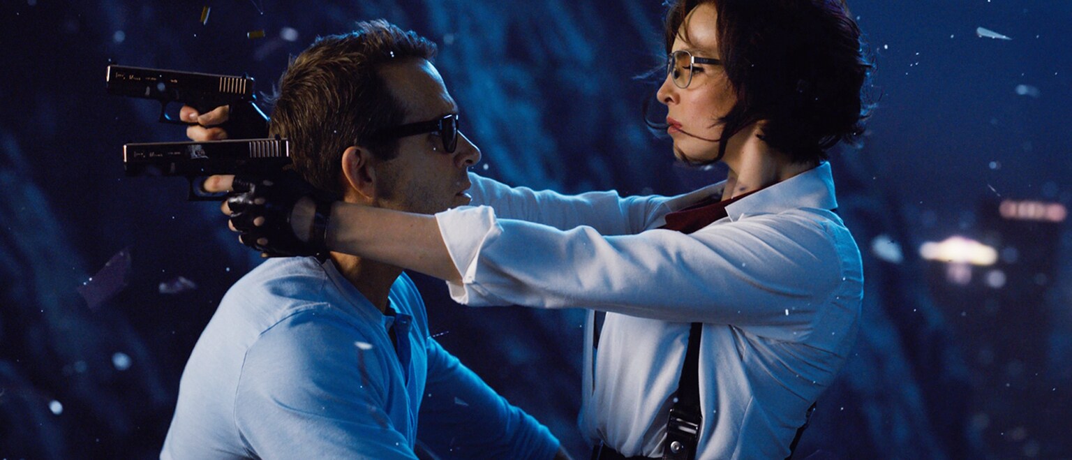 Ryan Reynolds (Guy) and Jodie Comer (Milly/Molotov Girl) from the 20th Century Studios movie Free Guy.