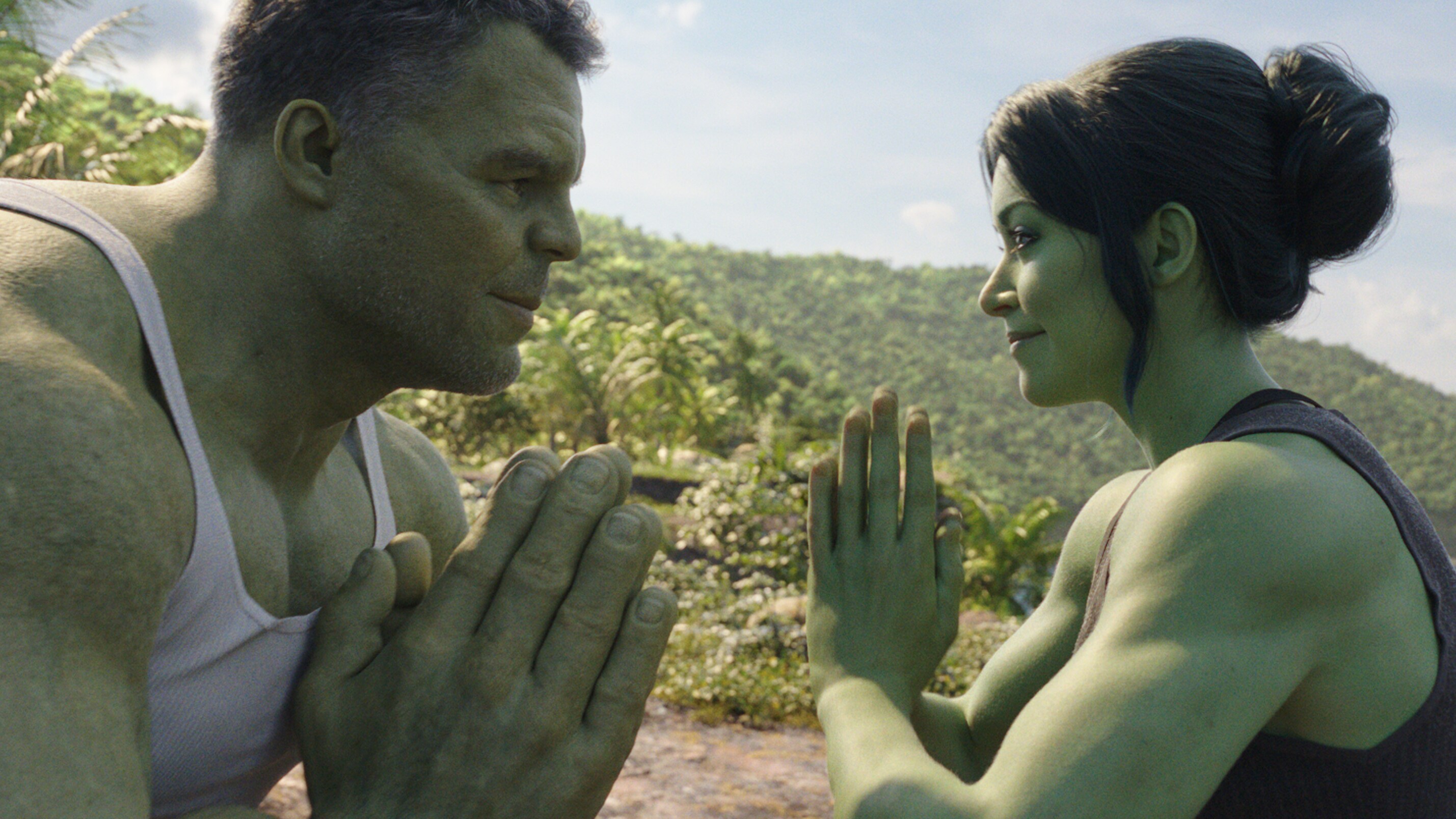 Hulk and She-Hulk facing each other.