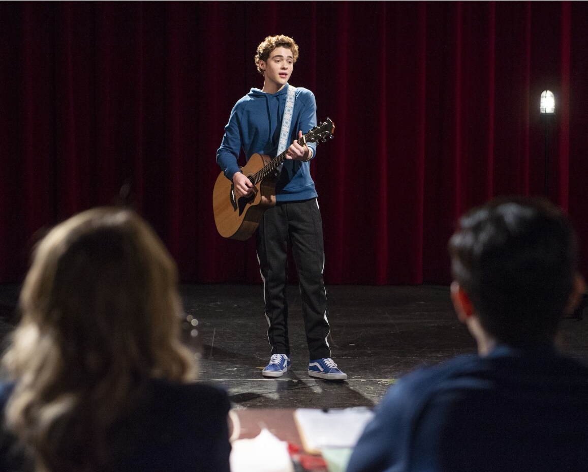 Joshua Bassett playing guitar