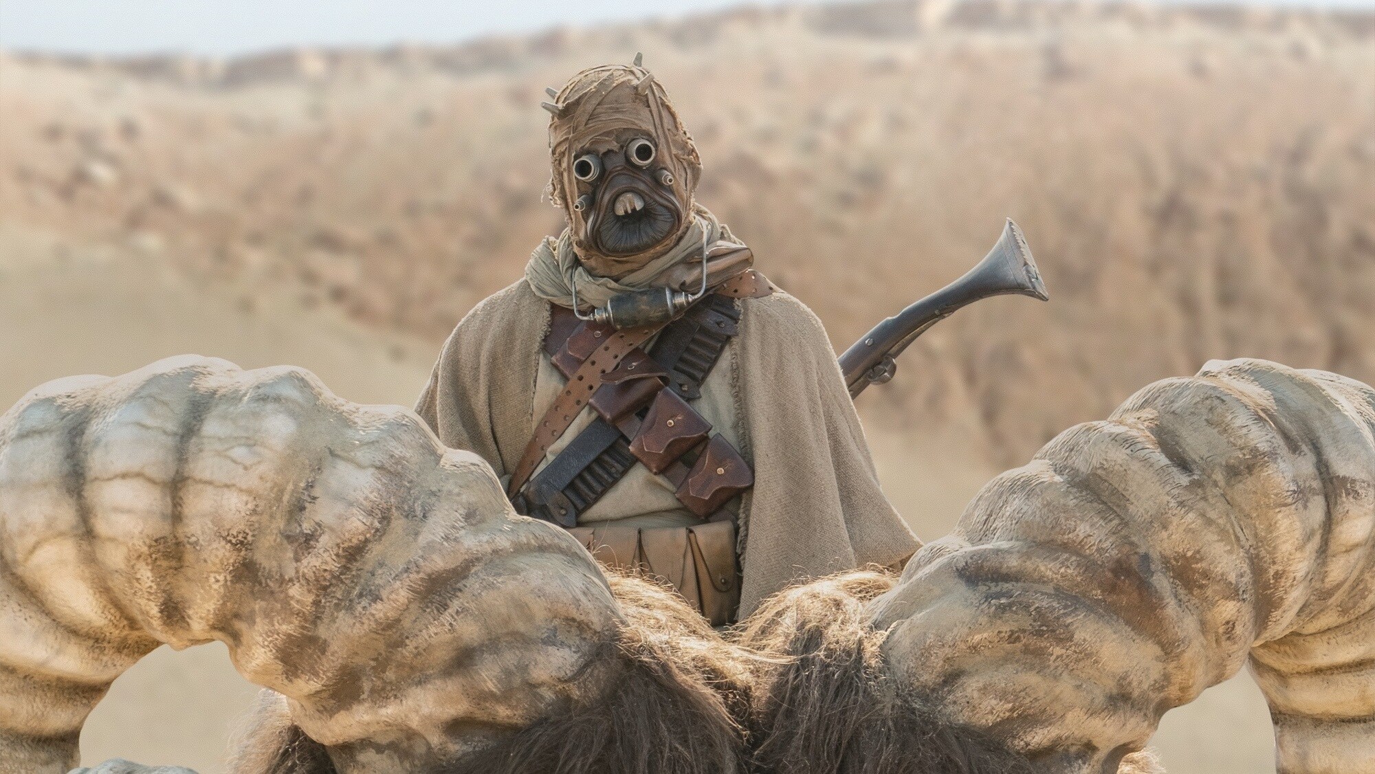  Tusken Raider and bantha in THE MANDALORIAN, season two, exclusively on Disney+