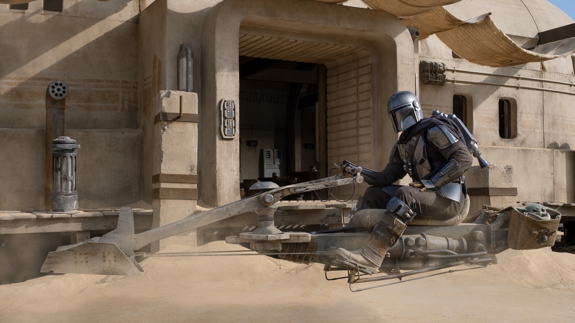 The Mandalorian (Pedro Pascal) and the Child in THE MANDALORIAN, season two, exclusively on Disney+