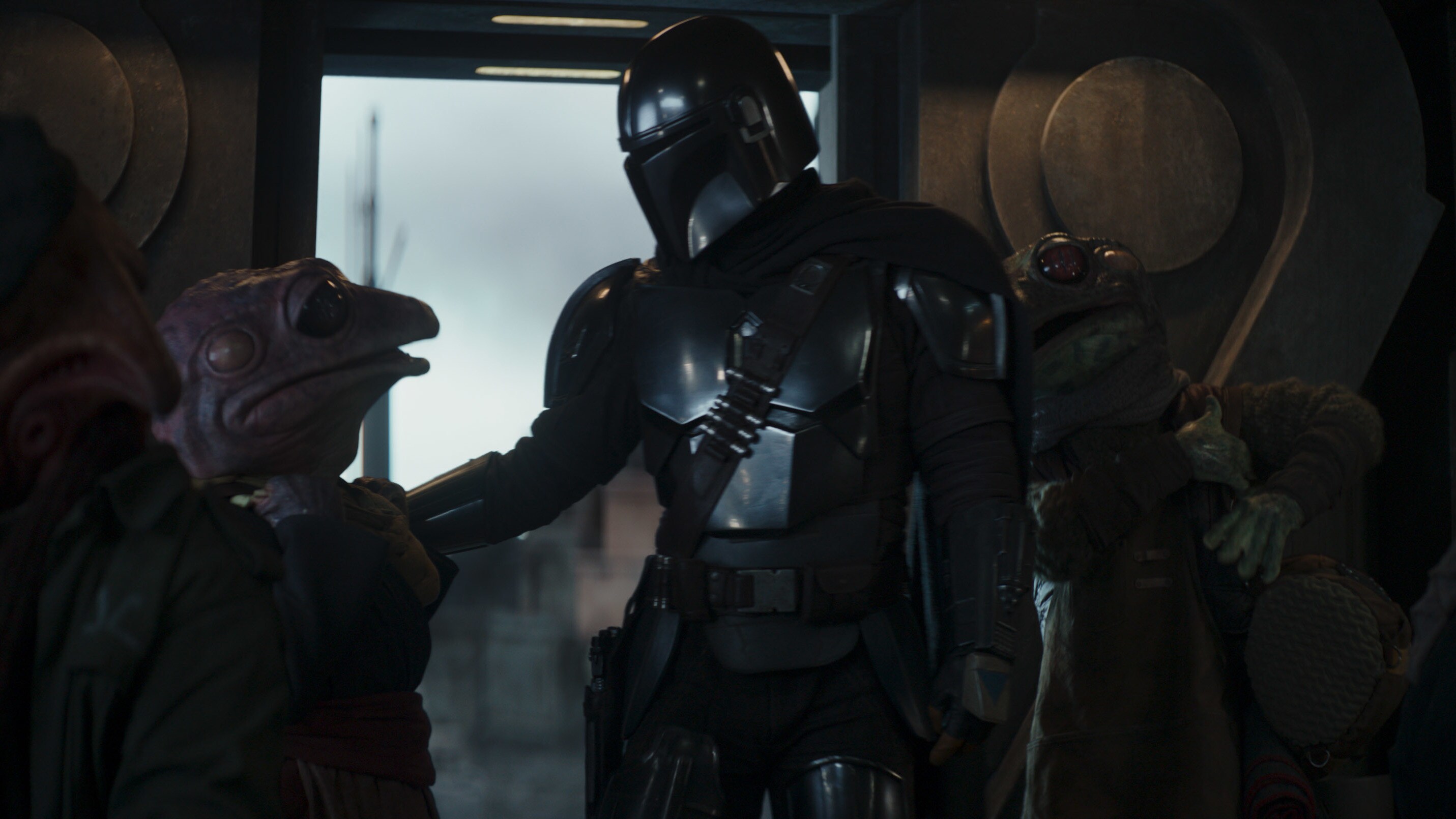 (Center, l-r): Frog Lady and the Mandalorian (Pedro Pascal) in Lucasfilm's THE MANDALORIAN, season two, exclusively on Disney+. © 2020 Lucasfilm Ltd. & ™. All Rights Reserved.