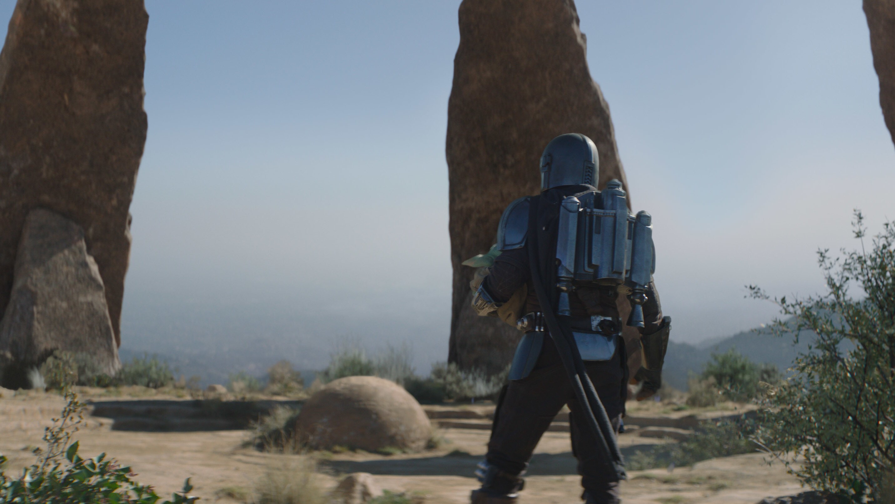 Grogu and the Mandalorian (Pedro Pascal) in Lucasfilm's THE MANDALORIAN, season two, exclusively on Disney+. © 2020 Lucasfilm Ltd. & ™. All Rights Reserved.