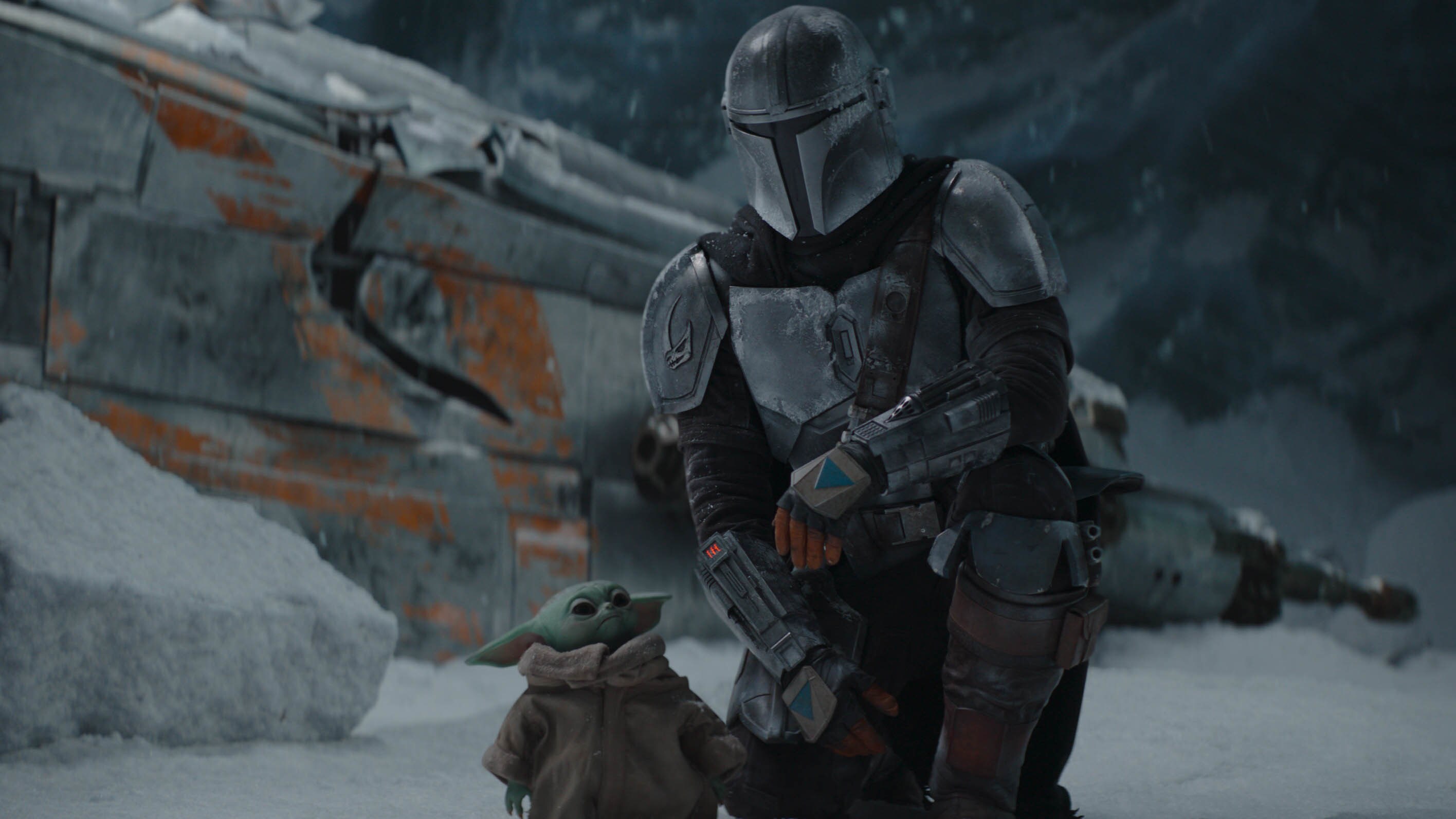 The Mandalorian (Pedro Pascal) and the Child in THE MANDALORIAN, season two. © 2020 Lucasfilm Ltd. & TM. All Rights Reserved.