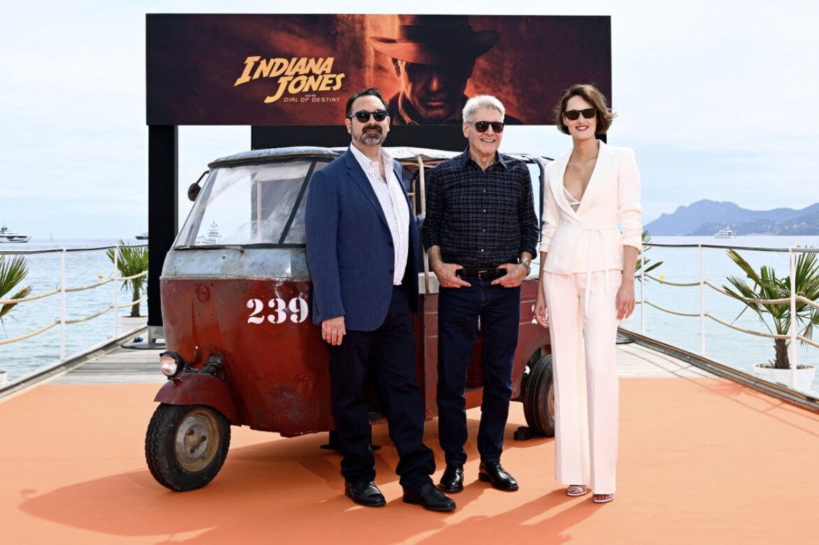 James Mangold, Harrison Ford and Phoebe Waller-Bridge stood in front of Tuk Tub at Indiana Jones and the Dial of Destiny Photo call in Cannes.